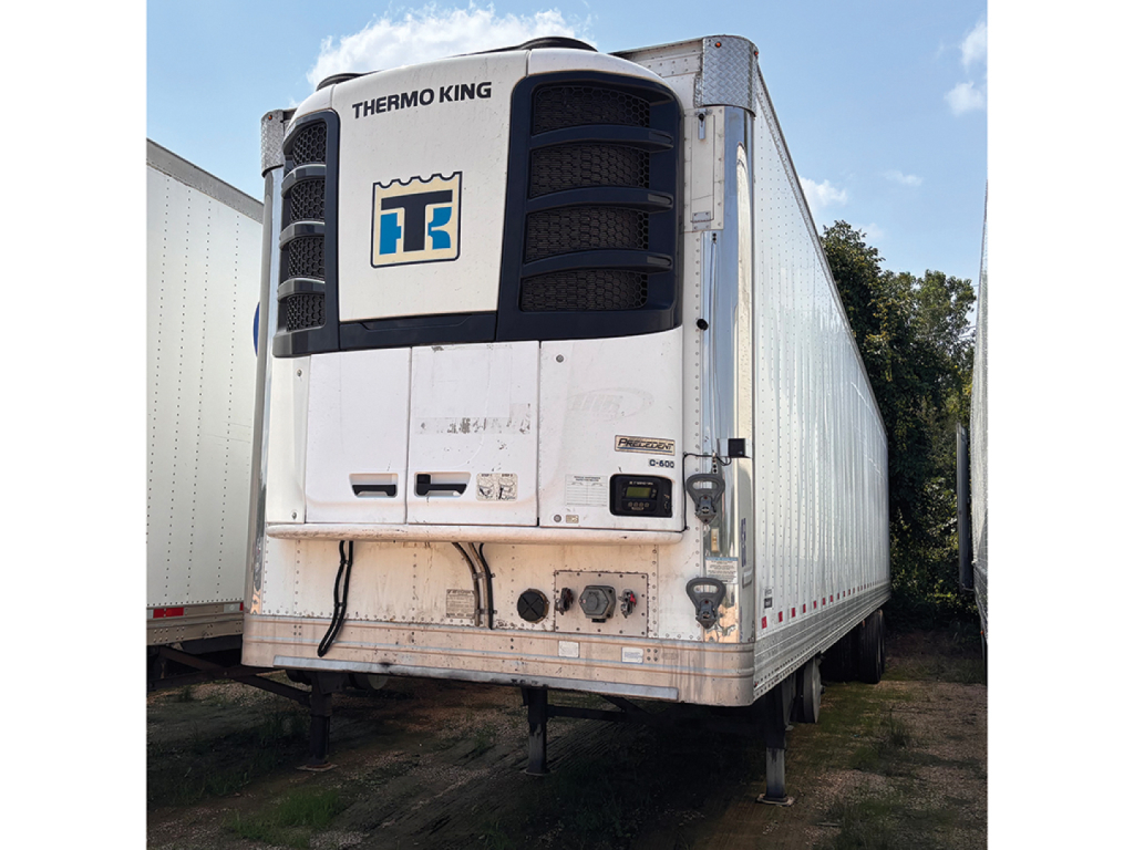 Thermo King reefer unit on front of Hyundai aluminum trailer with white exterior and Thermo King logo visible.