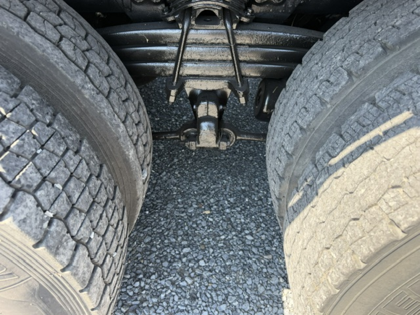 Sterling LT9500 wheel and suspension area showing dual rear tires and axle components.