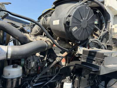 Engine bay of a 2006 Sterling LT9500 truck showing air intake, hoses, and components in view.