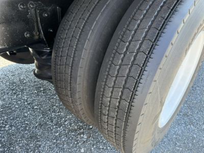 Sterling LT9500 front dual rear dual tires showing tread and wheel well.
