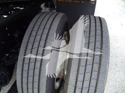 Dual rear tires on a 2019 International Durastar rollback truck showing tread and wheel hub.