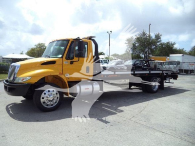 International Durastar rollback truck with yellow cab and flatbed, VIN 1HTMMMML4KH512255 visible.