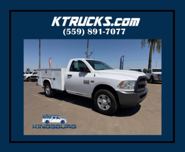 Ram 2500 service truck in white with utility bed, shown in dealership lot with KTruckS.com branding and KingSburg logo.