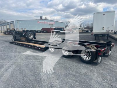  Fontaine 55H-Dsr lowboy trailer showing dual-axle configuration with stretched frame and attached ramps.