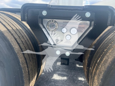 Fontaine 55H-Dsr trailer with control panel and dual rear tires showing hydraulic gauge and warning labels