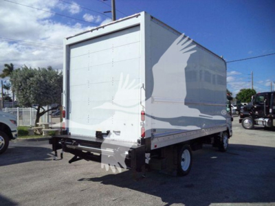 Isuzu NPR HD box truck rear view showing cargo area and closed rear doors.