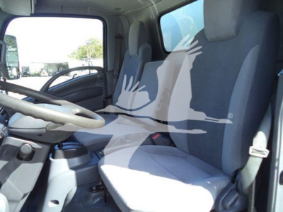 Isuzu NPR HD truck interior showing driver seat and passenger seat with steering wheel visible.