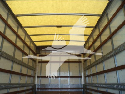 Isuzu NPR HD truck cargo area image showing empty box truck interior with side rails.