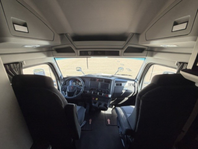 Kenworth T680 cab interior view from entry, dashboard and seats visible