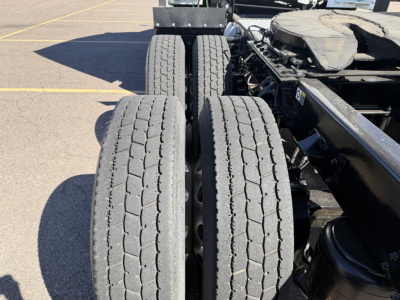 Kenworth T680 tractor rear wheels and chassis showing dual rear tires and part of frame.