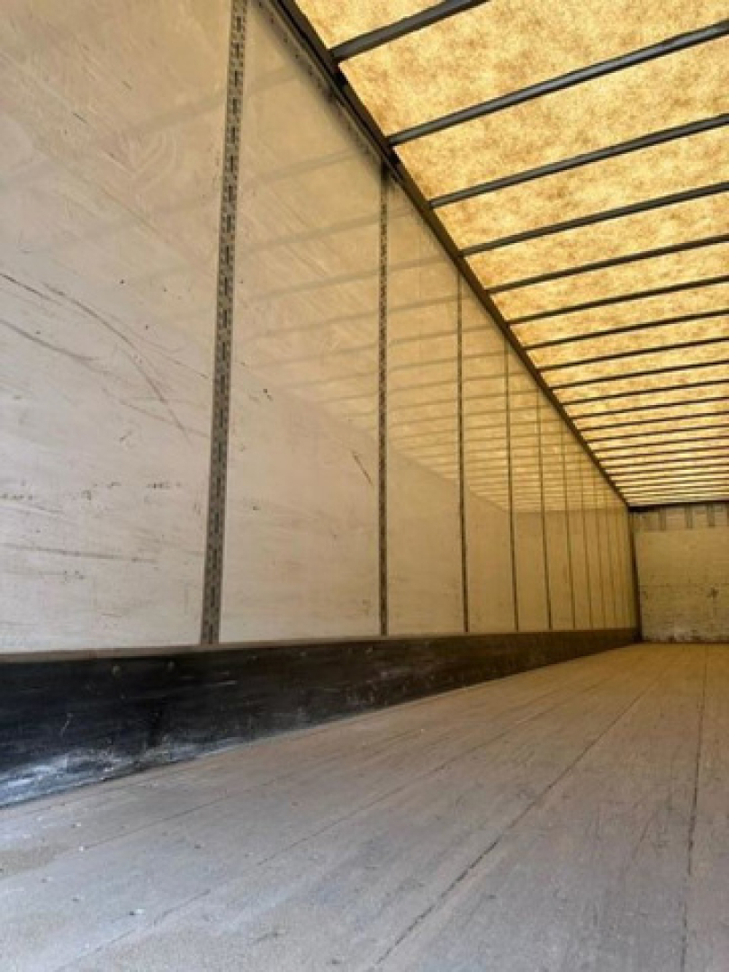 Trailer interior showing wooden floor and sidewalls of a 2016 Wabash van trailer.