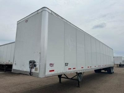 Trailer side view showing a 53' Wabash van with aluminum exterior and tandem rear wheels.