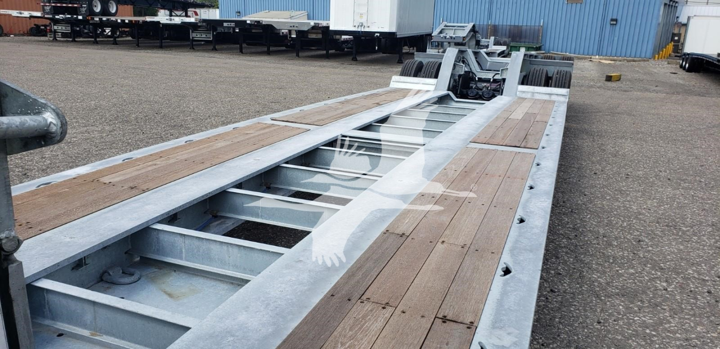 LDH trailer in-service deck with wooden planks and metallic frame showing mounting rails and winch area