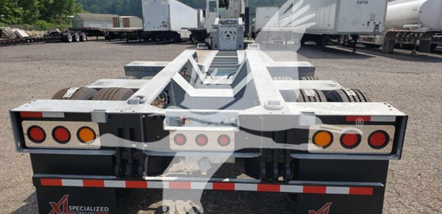 Trailer rear view showing 55 ton XL Specialized lowboy with 15 inch LDH galvanized components and taillights.