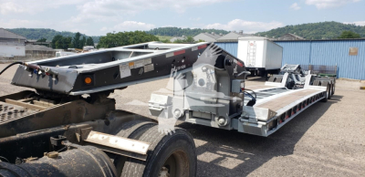 Lowboy trailer with 15-inch LDH specialization showing deck and hydraulic components.