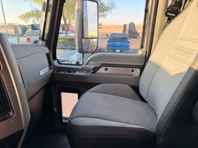 Truck cab interior showing passenger seat and door panel; no visible gauges or branding text legible.