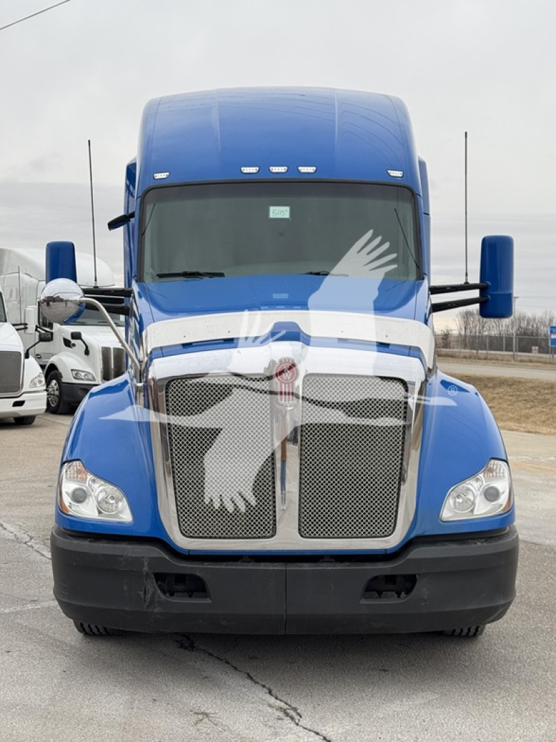Front view of a blue 2016 Kenworth T680 conventional sleeper truck showing chrome grille and badge, large headlights, and extended cab with mirrors.