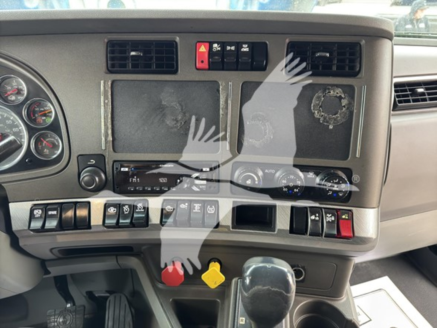 Kenworth T680 truck interior dashboard showing control panels, vents, switches, and gauges.