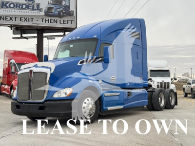 Kenworth T680 tractor unit in blue, side view showing LEASE TO OWN watermark