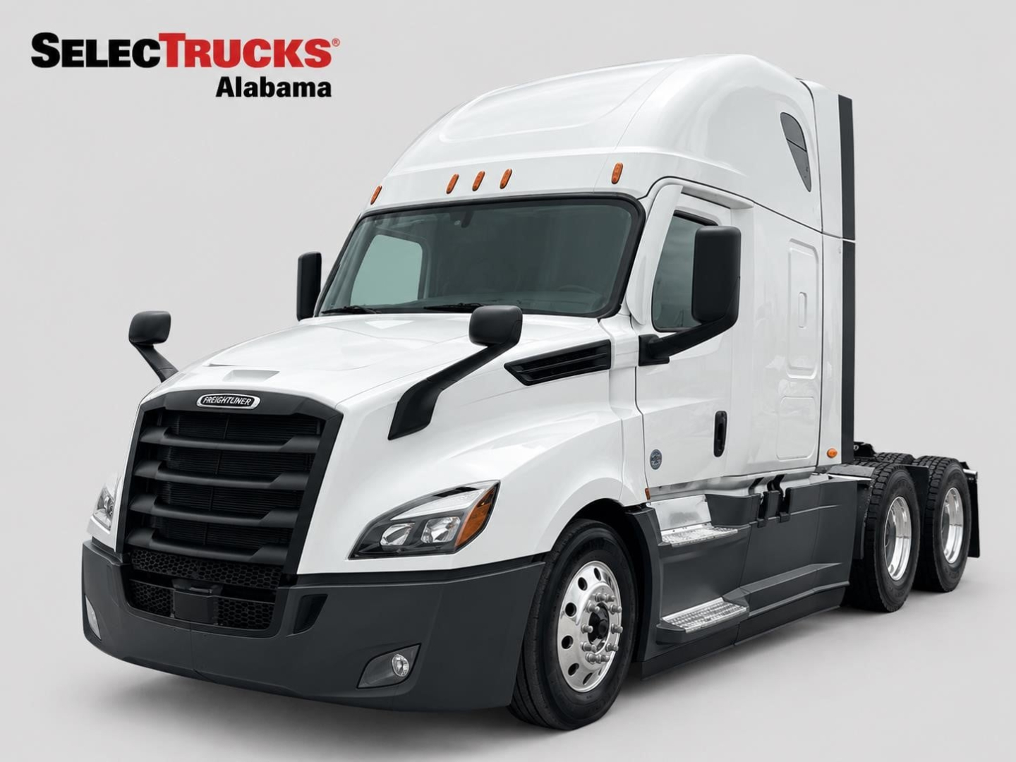 Truck cab side angle shot of a white 2022 Freightliner Cascadia 126 sleeper with black accents and logo, showing front grille and dual rear wheels.