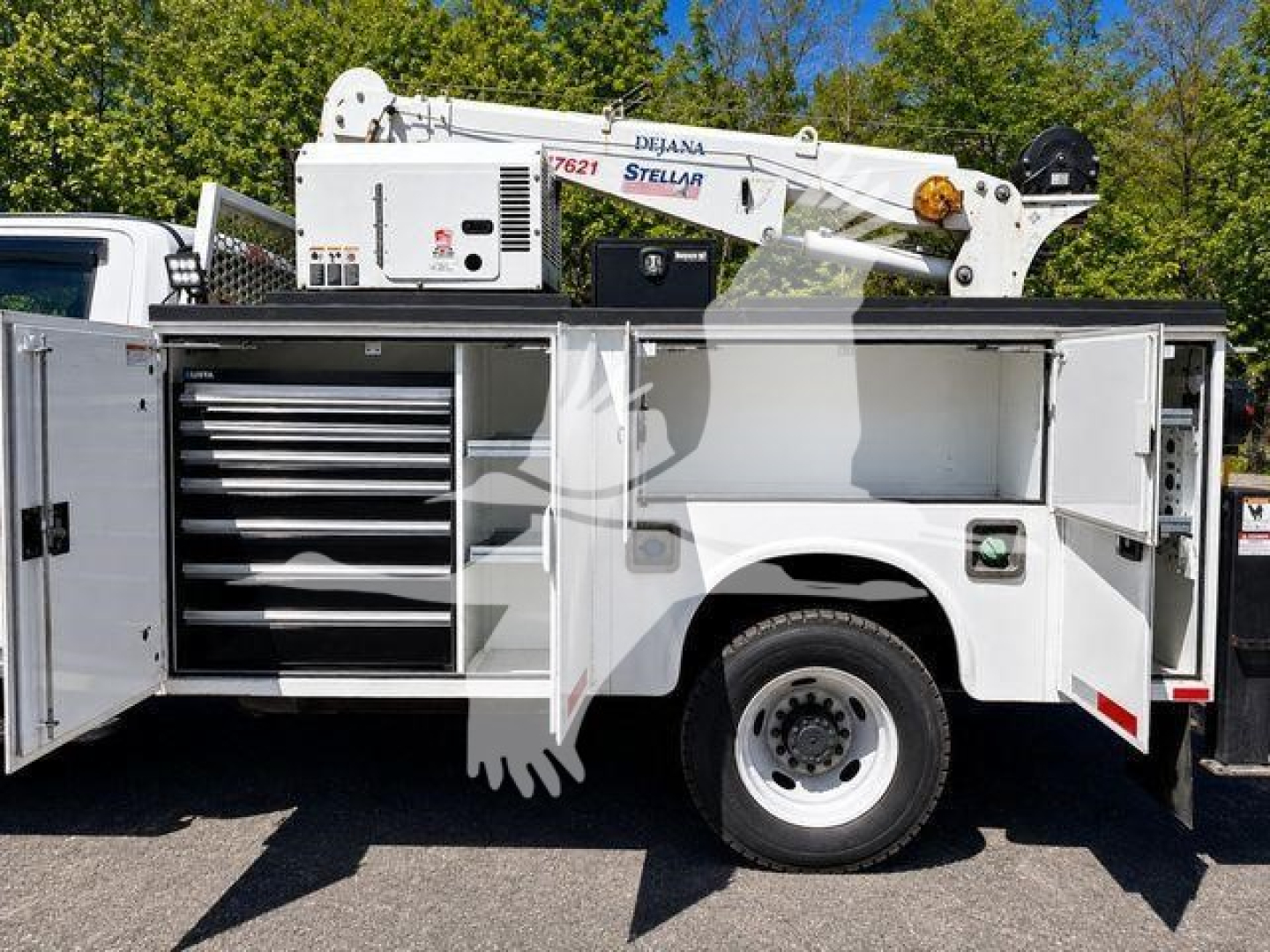 Service/Utility truck side view with open tool compartments and crane, 2019 Ford F550, stock T03596.
