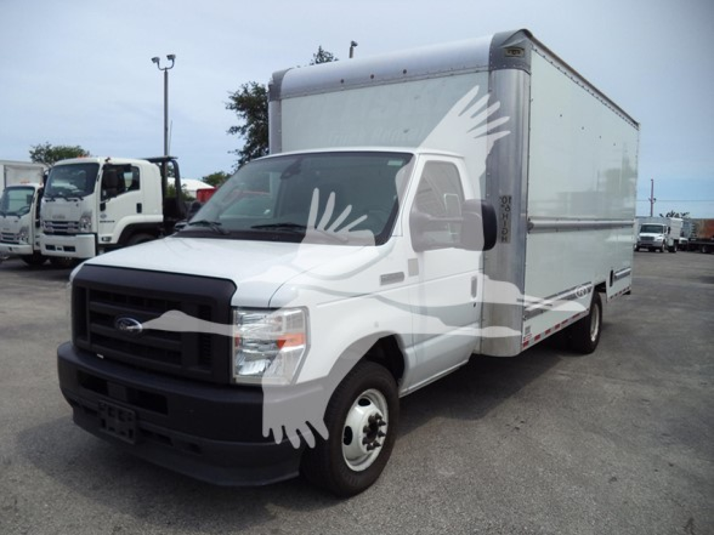 Ford E-350 cargo box truck side view showing cab and box with white exterior and black front grille.