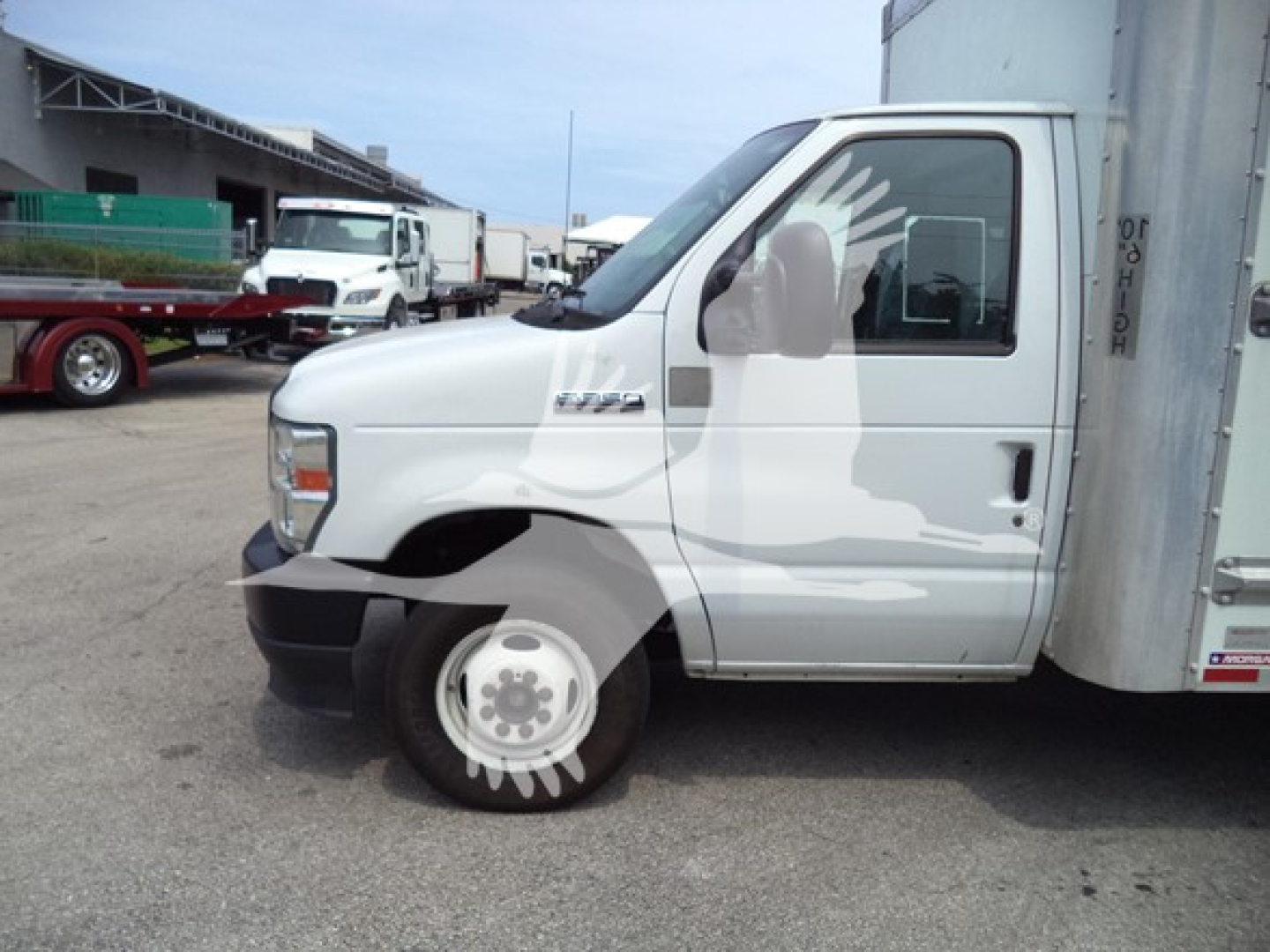 Ford E-350 cutaway truck cab side showing front wheel and side mirror