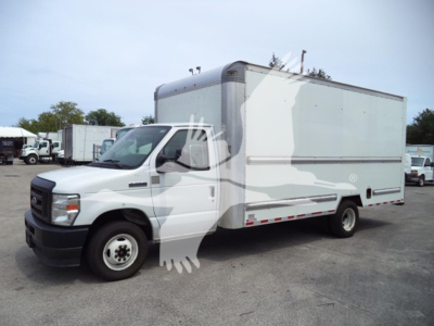 Ford E-Series 350 cutaway box truck side view showing cargo box and cab in white with gray accents.