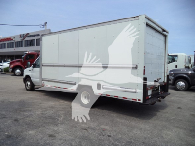 Truck body of a 2022 Ford E350 high cube/cutaway showing cargo box with side access and rear doors.