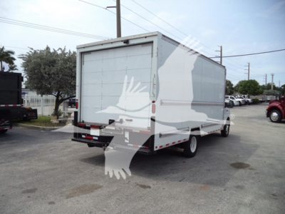 Ford E-350 utility box truck rear three-quarter view showing cargo box with side graphic and rear doors, VIN label not visible. 