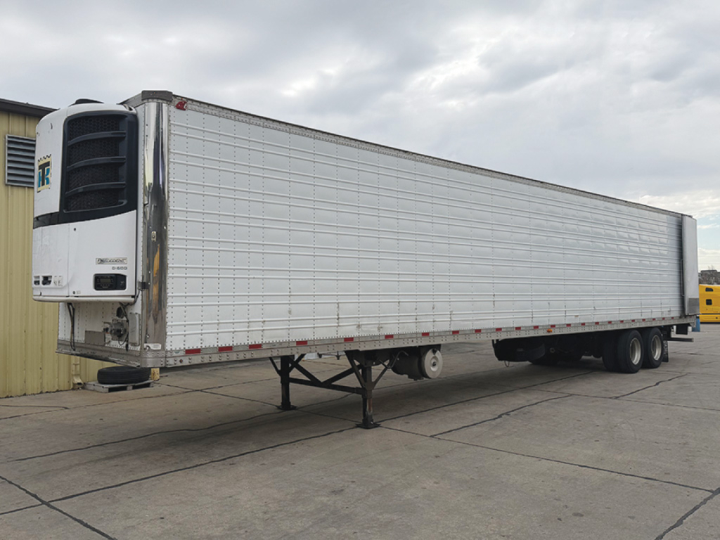 Great Dane Everest SS reefer trailer in-view showing front refrigeration unit and side panels; trailer on landing gear with dual rear axles.