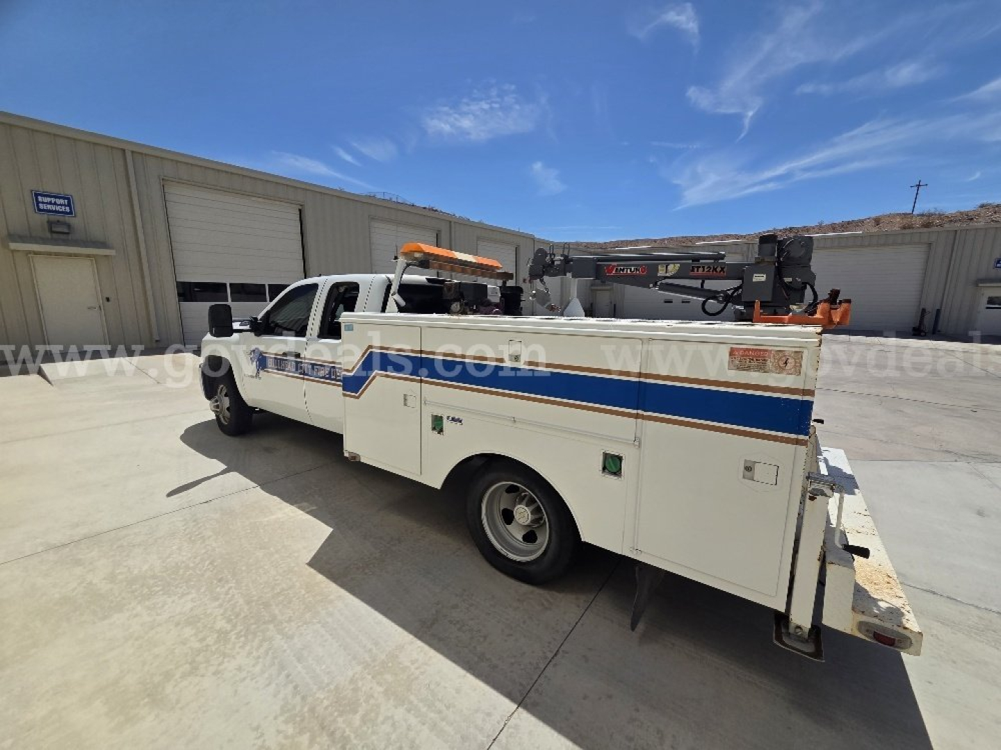 2009 Chevrolet Silverado 3500HD service utility truck with utility bed and crane, side view showing stock number 9764-25 and VIN 1GBJK79619E130307.