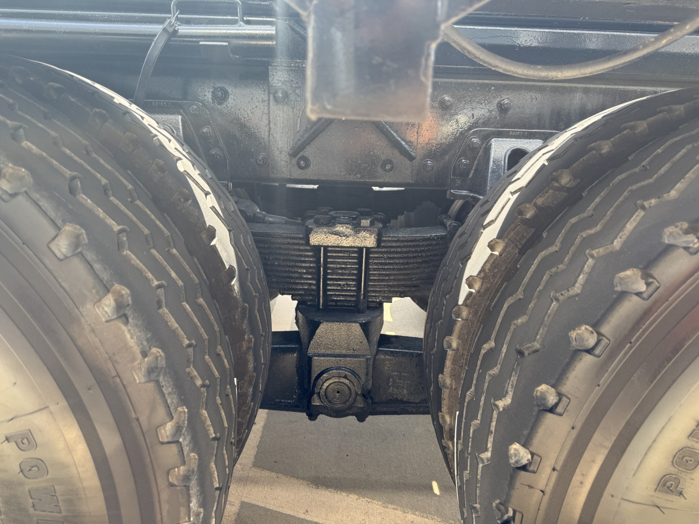 Kenworth T880 rear duals view showing drive axle and suspension components