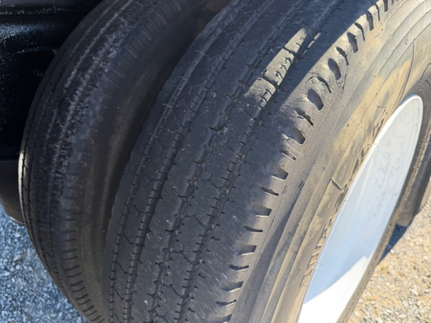 Volvo VHD crane truck wheel showing tire tread and wheel rim.