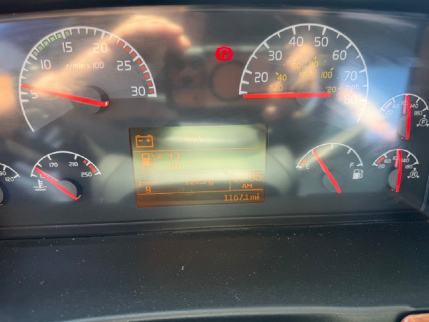 Dashboard of a used 2006 Volvo VHD crane truck showing multiple analog gauges and an orange digital display in the center.