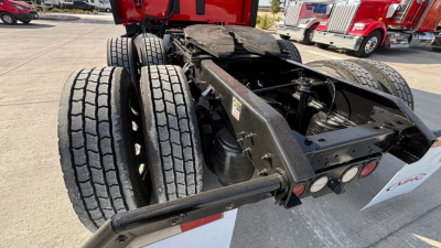 Kenworth T680 chassis and rear dual tandem axle showing wheels and frame members.