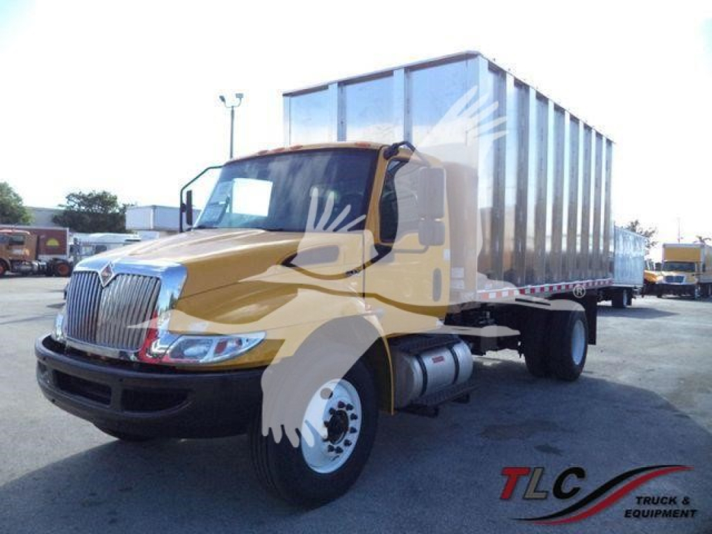 International 4300 medium-duty truck with a yellow cab and large silver dump bed showing stock number 4300YELLOWCHIPFM.
