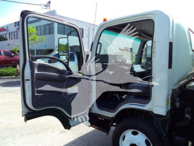 Isuzu NRR truck cab with front doors open, interior view visible