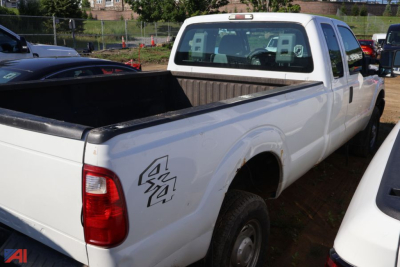 2016 Ford F-250 Super Duty pickup truck in white with extended cab, long bed, rear side 4x4 badge on the quarter panel.