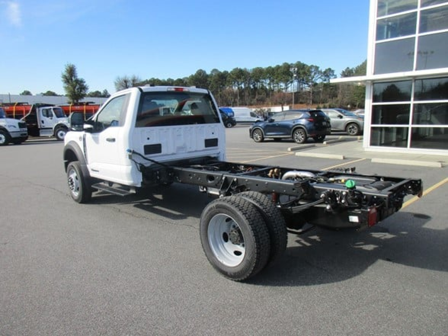 Ford F-450 cab and chassis side view showing chassis frame and single rear wheel