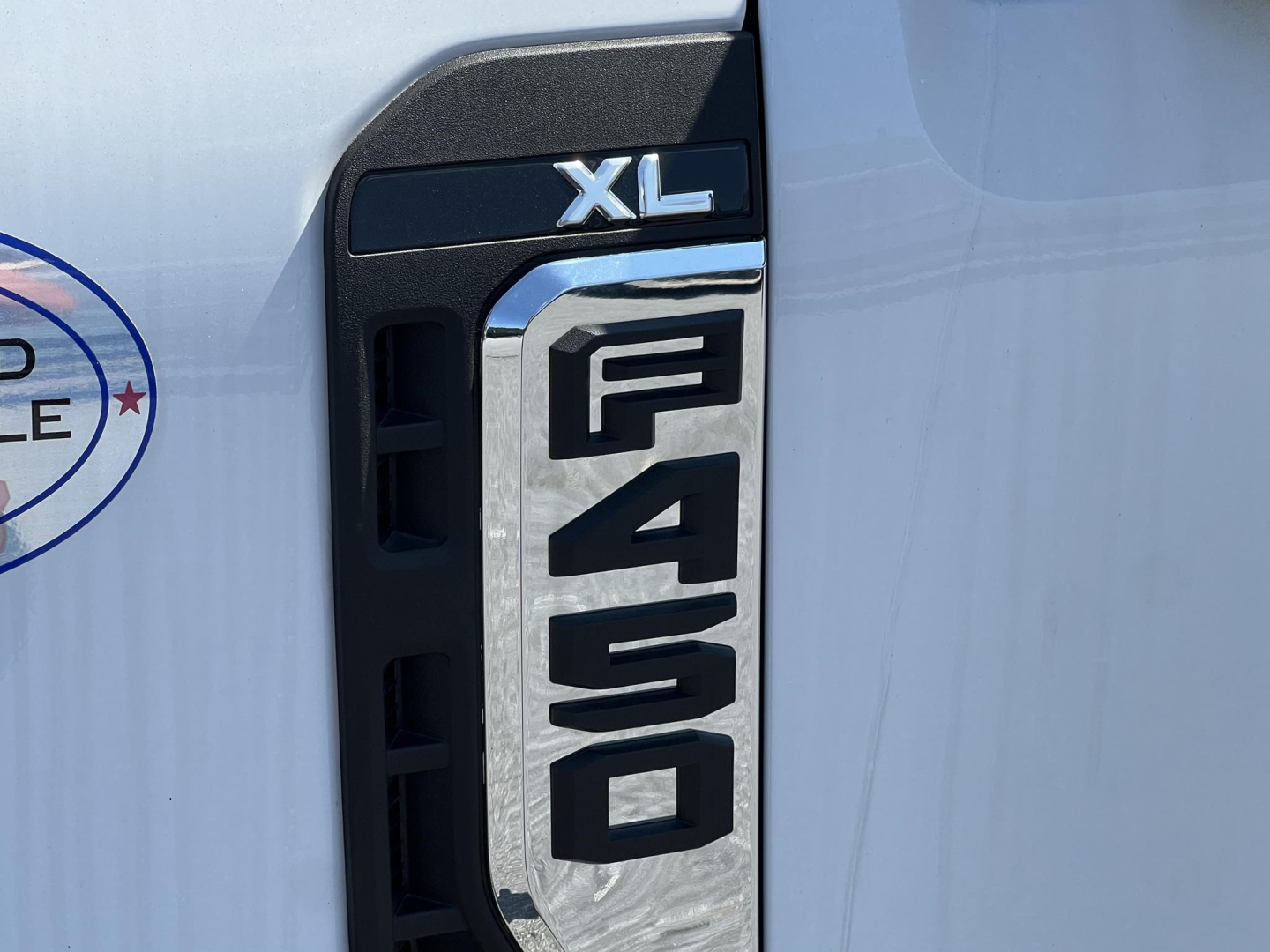 Ford F-450 XL cab and chassis side badge with large F-450 numerals and XL label.