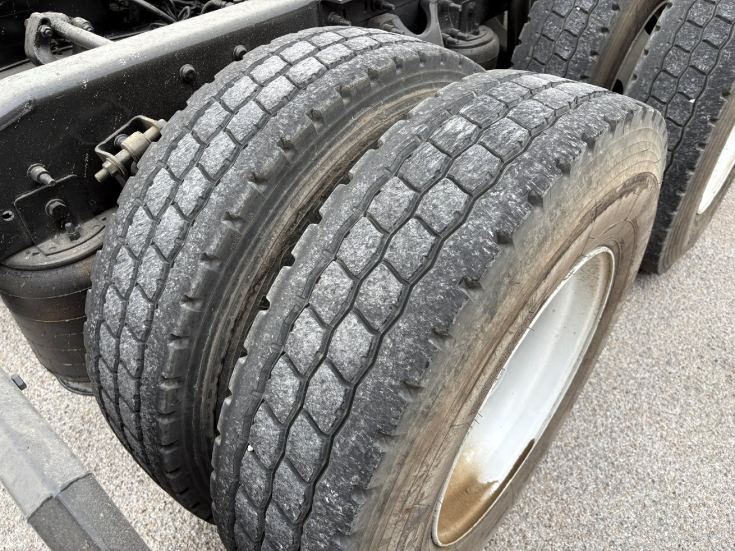 Tandem rear dual tires of a 2019 International LT truck showing tread pattern and wheel rims.