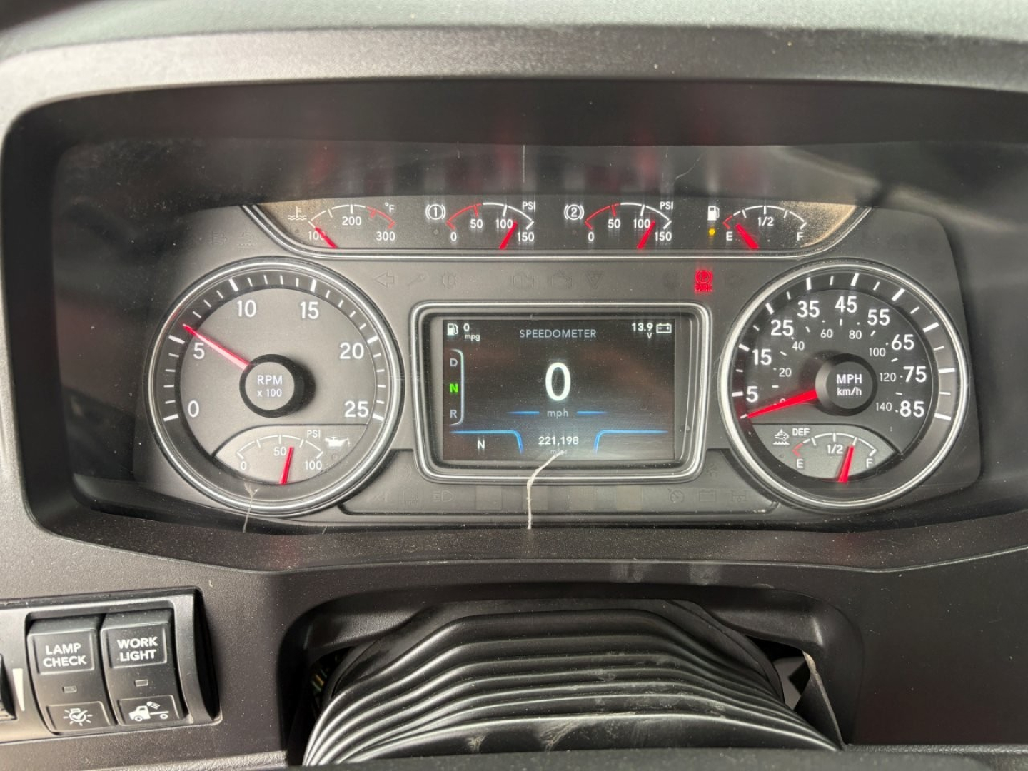 Dashboard of a 2019 International LT showing speedometer, tachometer, and central digital display with 0 speed.