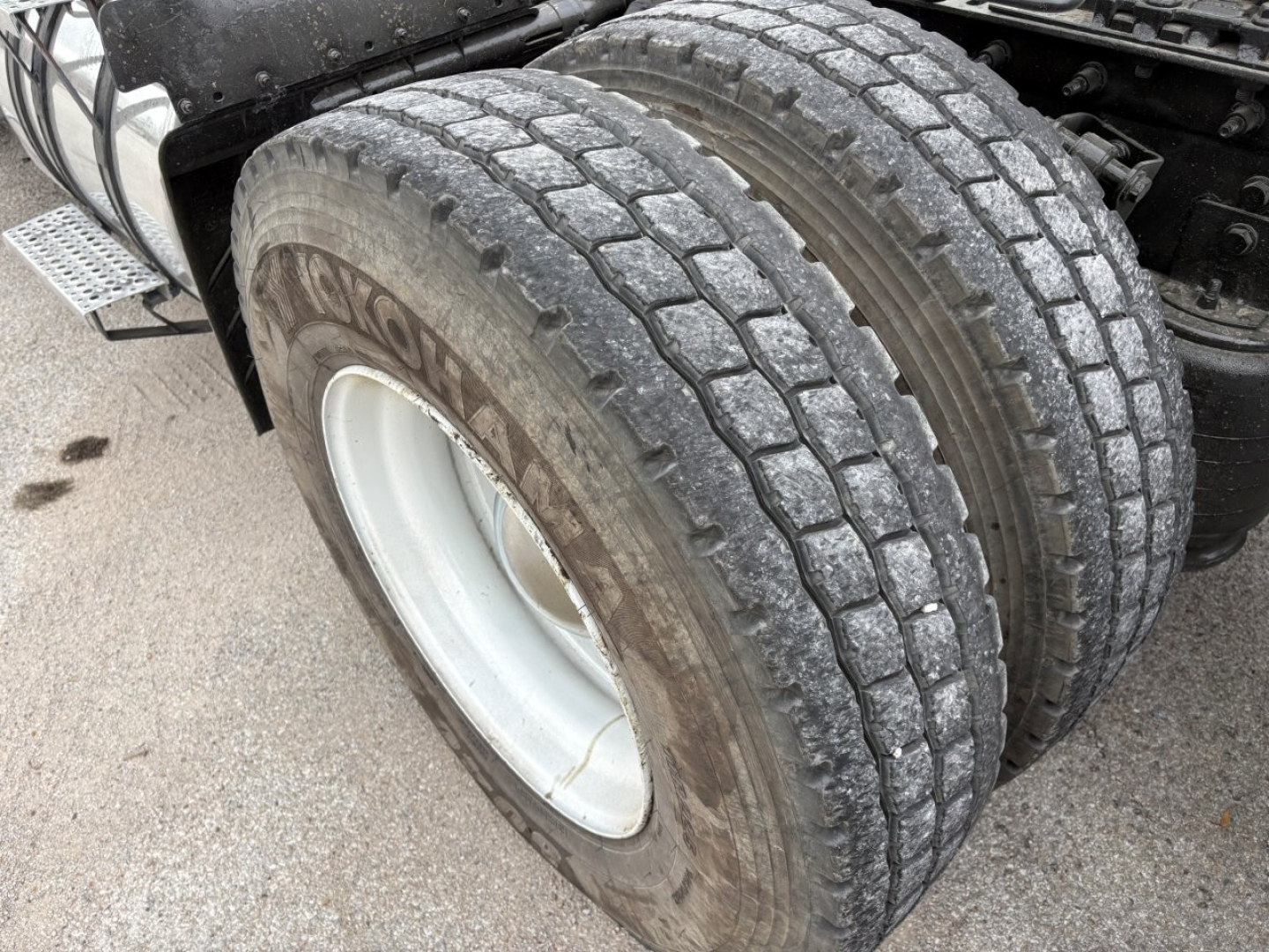 Twin rear wheel of a 2019 International LT truck showing treaded tires and wheel rims in service condition