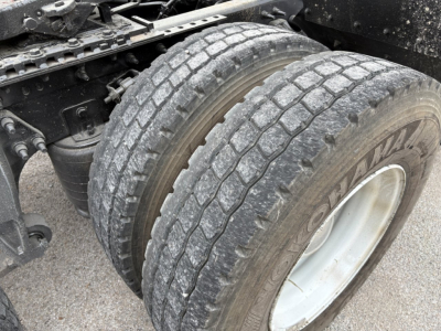 Truck rear dual tires and suspension components in view on a used 2019 International LT