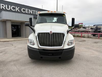 International LT truck front view showing grille, headlights, and bumper in a dealership lot.