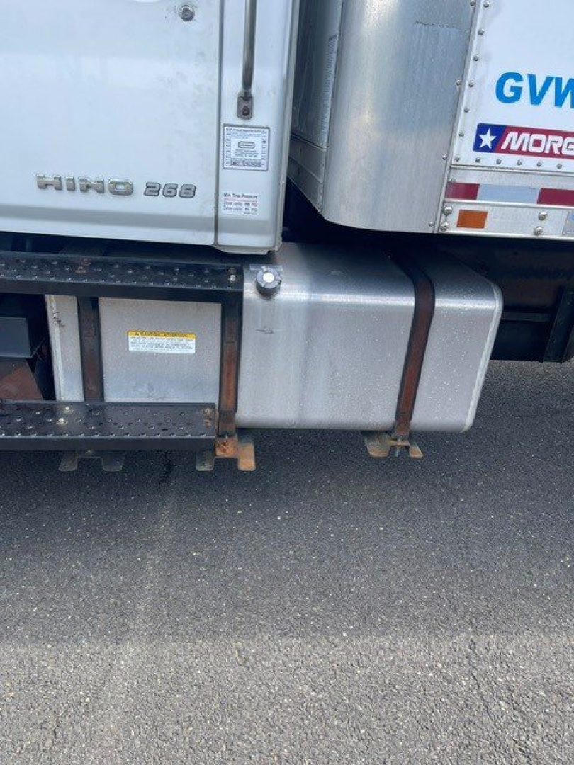 Hino 268 badge on lower cab with fuel tank and side step visible.