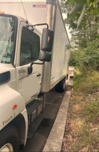 2019 Hino 268 box van truck cab and side showing Morgan trailer logo on box