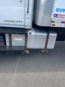 Hino 268 badge on lower cab with fuel tank and side step visible.