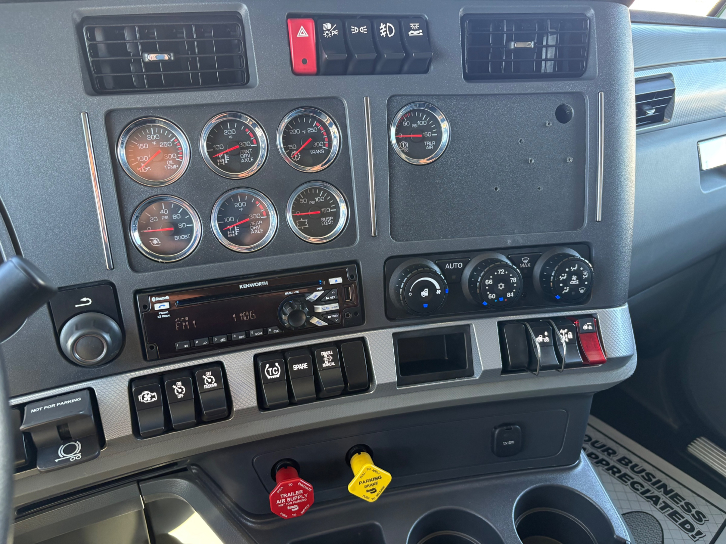 Kenworth T680 dashboard view showing gauge cluster and climate controls